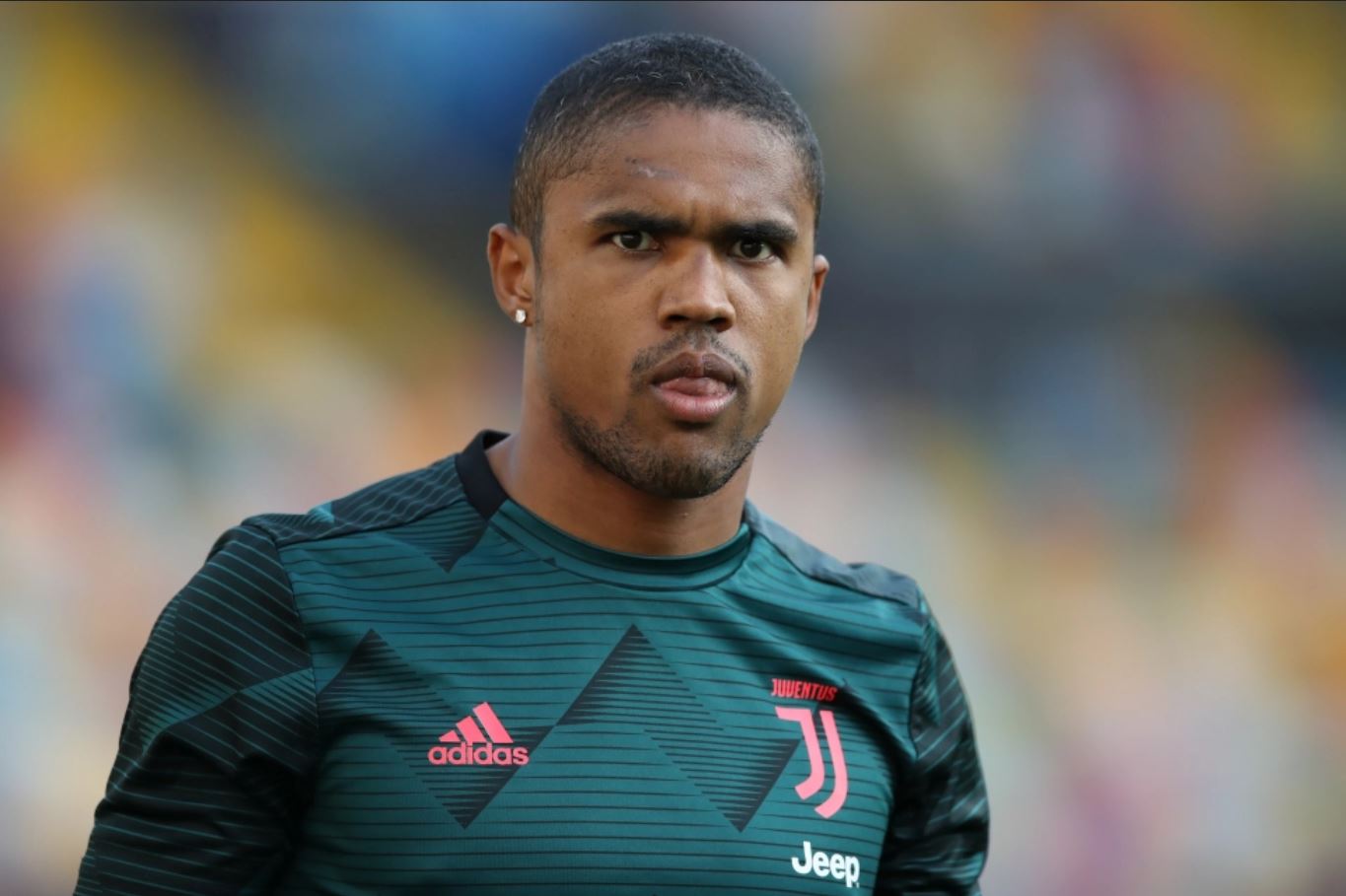 Juventus' Douglas Costa had been linked with a move to Man United but the Brazilian wants to fight for his place in Andrea Pirlo's side