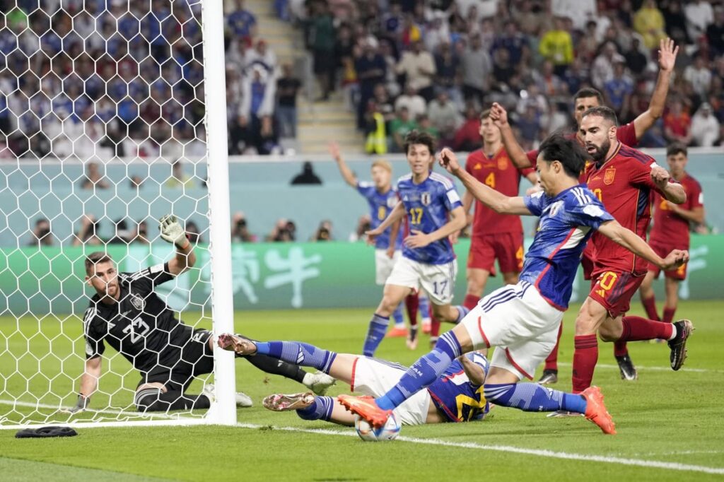 Japan and Spain qualified to the knockouts as the Samurai Blue came from behind to beat Luis Enrique's side 2-1 to grab the first place in the pool