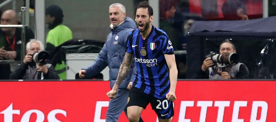 Hakan Calhanoglu celebrates scoring for Inter against Milan